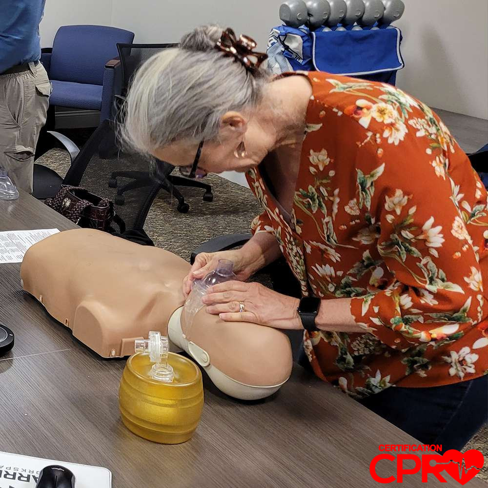 CPR training session with adult mannequin in Las Vegas.