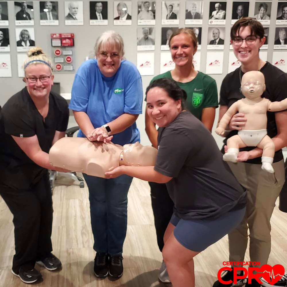 CPR training class in Las Vegas with students practicing on mannequins.